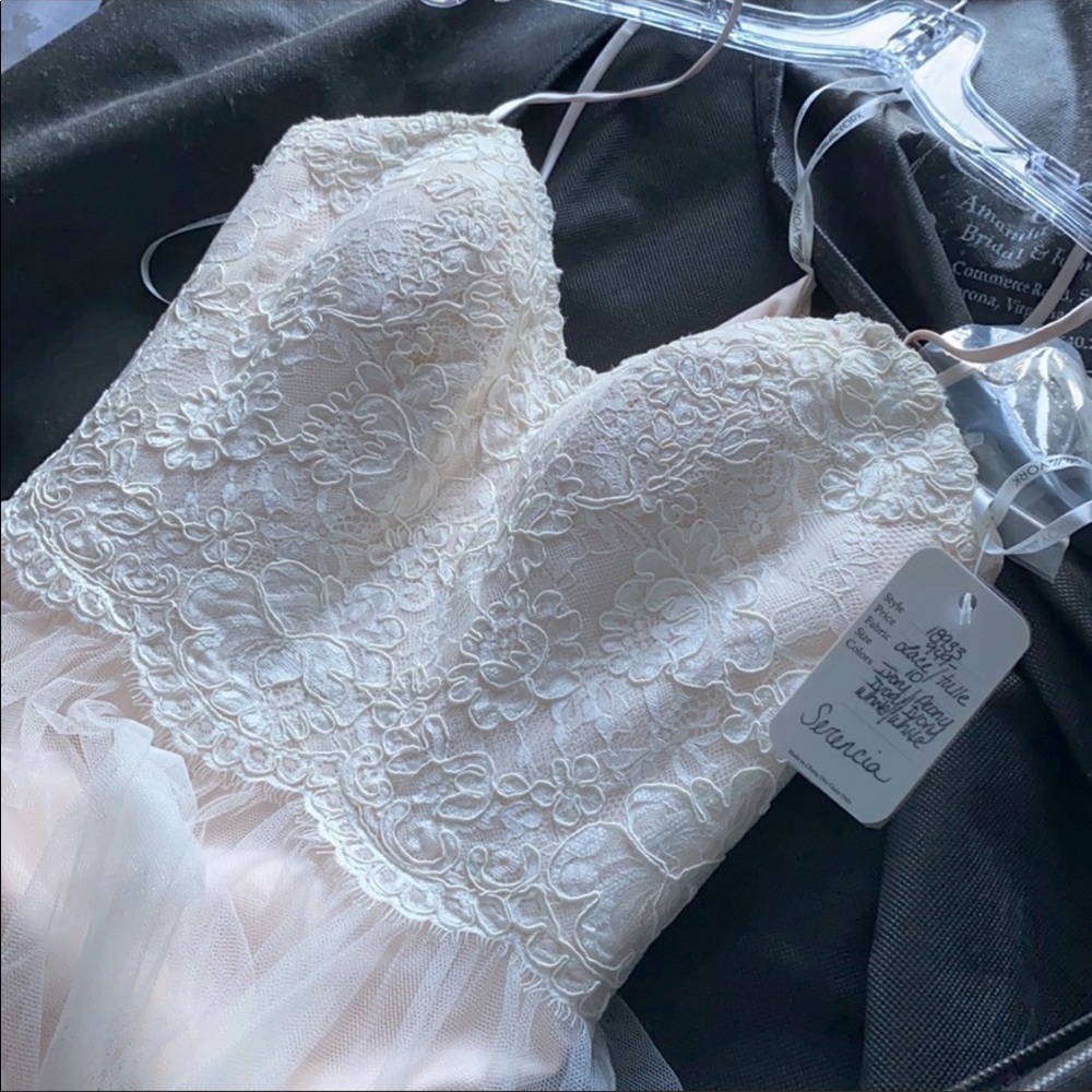 Wedding dress never worn no alterations